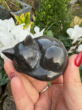 Load image into Gallery viewer, Silver Sheen Obsidian Sleeping Cat Carving
